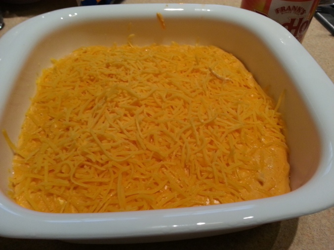transfer into a casserole dish and sprinkle with remaining cheddar. 